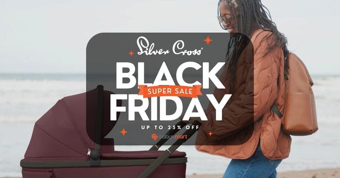 Person with a stroller on a beach, featuring Silver Cross Black Friday sale text overlay.